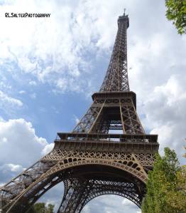 The Eiffel tower, Paris. A full view if the Eiffel tower angled from below and slightly in front.